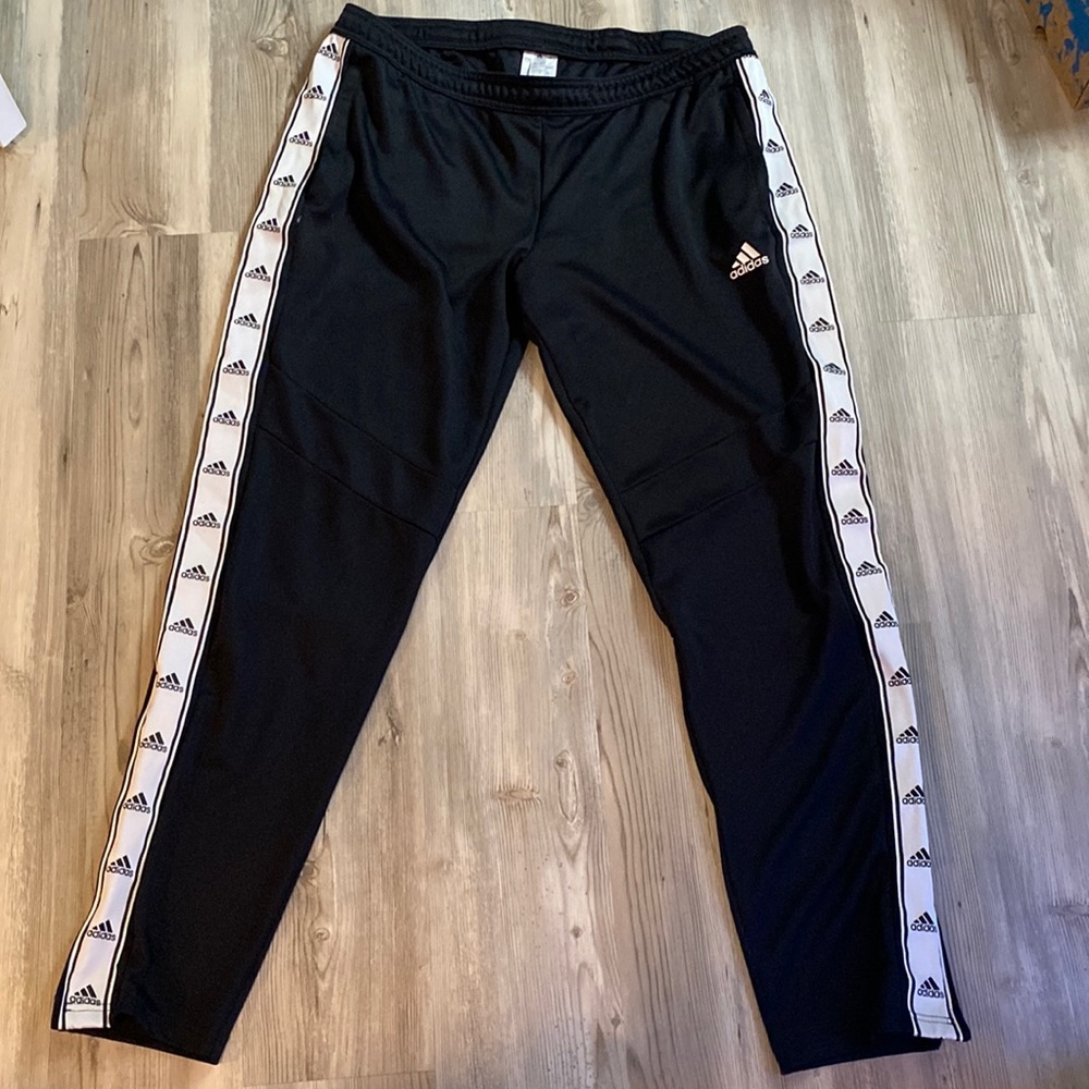 I am selling black and white Adidas sweatpants. These are a size L.